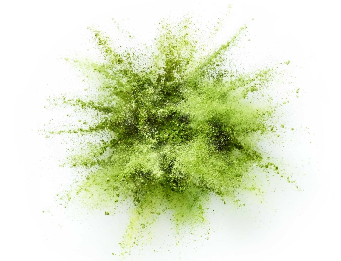 das Bild zeigt eine grüne Puder oder Powder Explosion